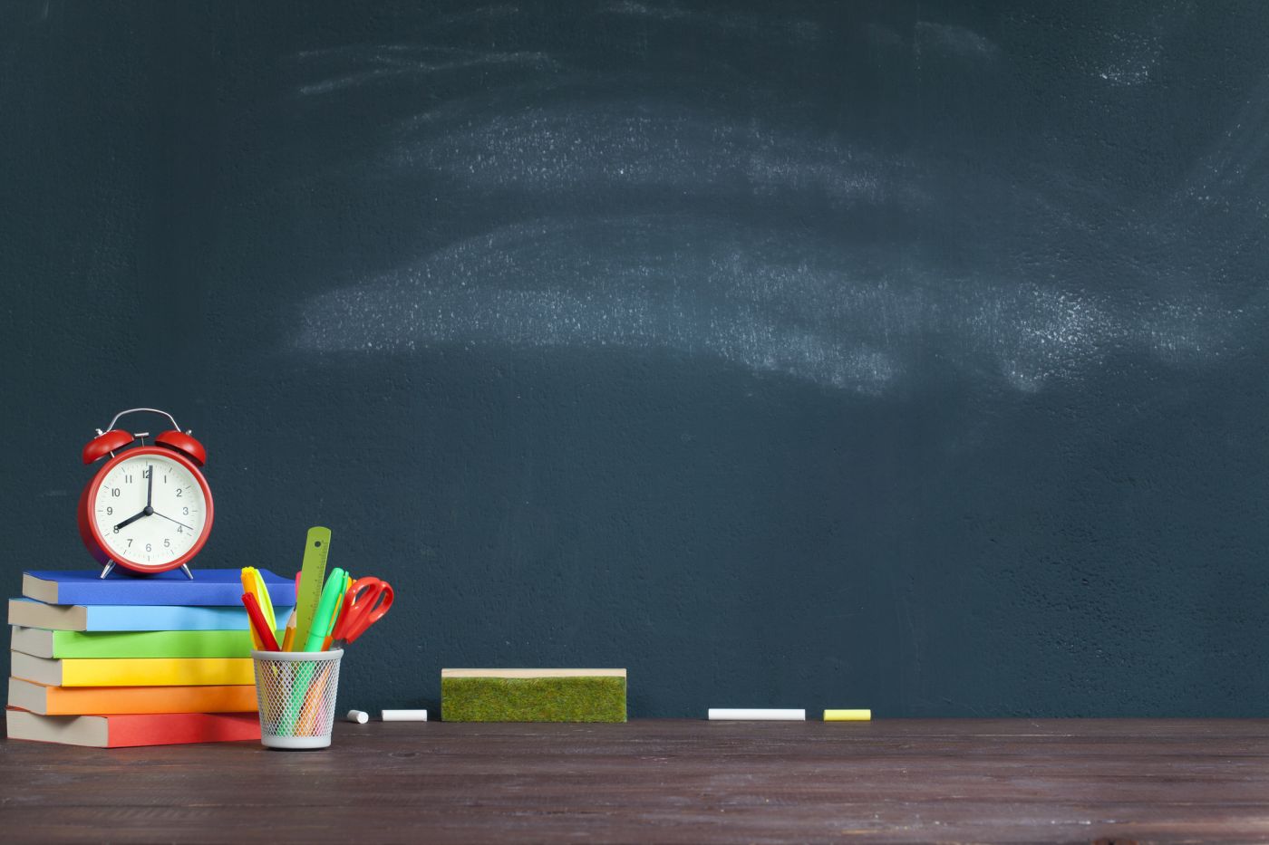 chalkboard with school supplies